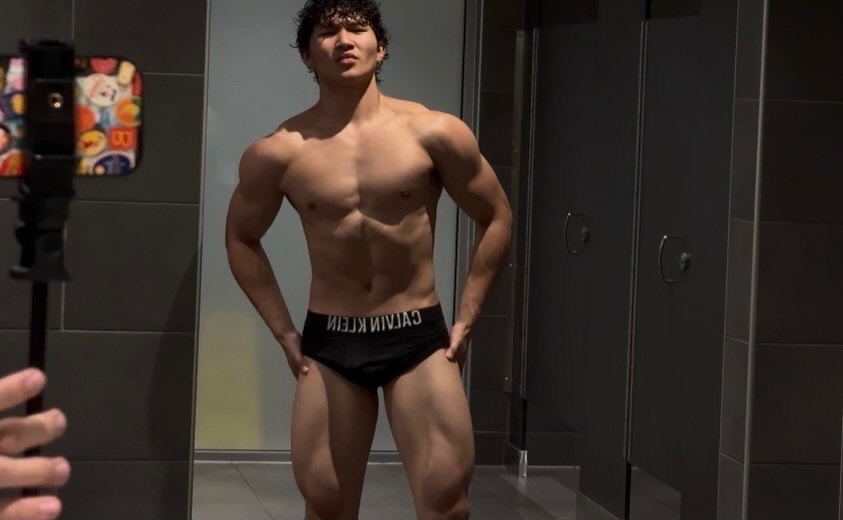 Frontal physique shot showing chest and shoulder mass gained through training